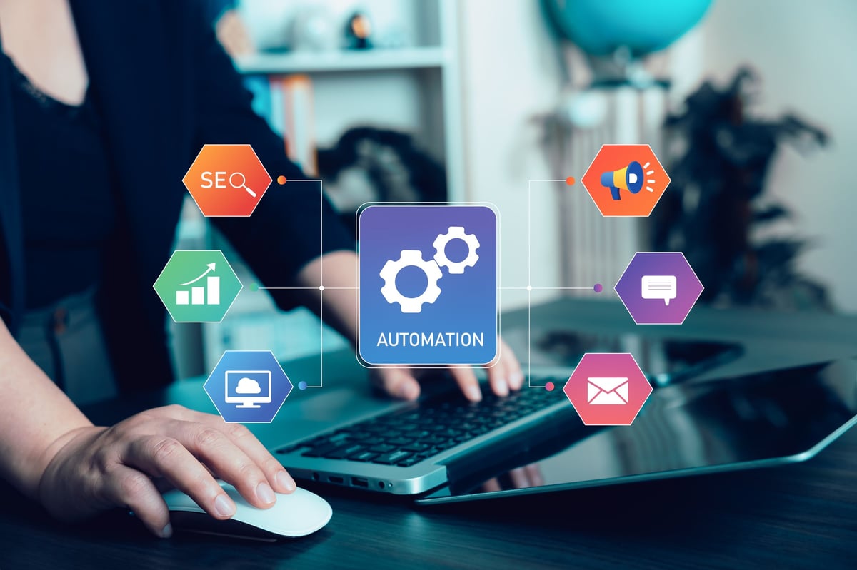 Business professional using laptop with marketing automation dashboard connecting SEO analytics, advertising, messaging, email marketing, and performance growth tools